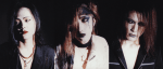 An advertisement image of the band Kuroyume, a 1990s Japanese Visual kei band featuring band members Hitoki (bass), Kiyoharu (vocals), and Shin (guitar), pictured from left to right.