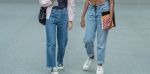 2 pairs of legs wearing baggy jeans and white tennis shoes