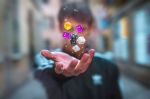 close up shot of a human hand throwing dice into the air