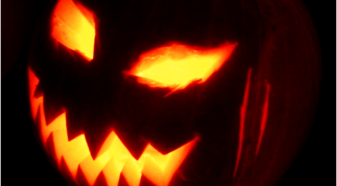 Halloween lantern with glowing eyes and mouth